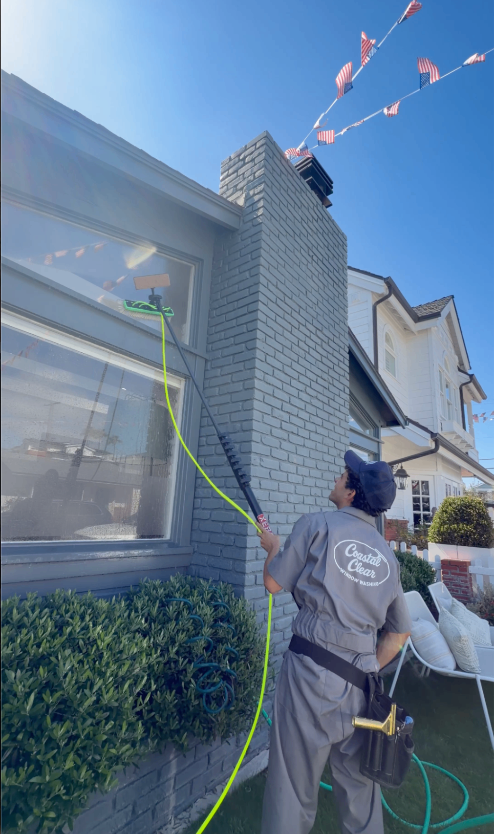 Cleaning windows on a brick home